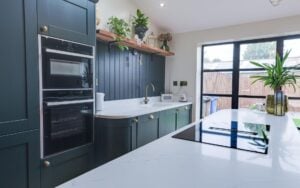 Madison Kitchen in Deep Forest and Vintage Pink by Homestyle Kitchens
