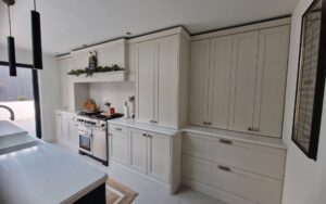 Aldana Kitchen in Shell & Cannon Black by Timeless Kitchens