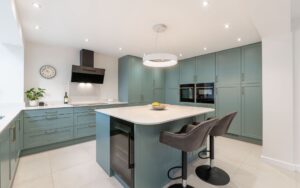 Aldana Kitchen in Light Teal by Kitchen Ergonomics