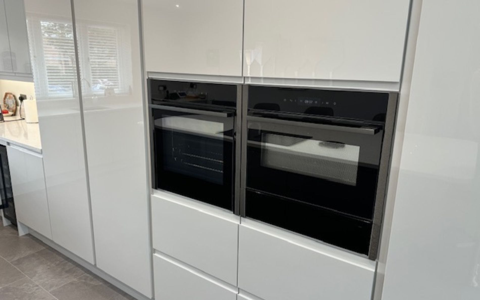 Strada Gloss Kitchen in Light Grey & Graphite by DCL Kitchens