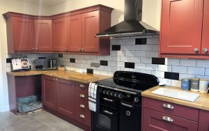 Wakefield Kitchen in Antique Red by Kinder Kitchens