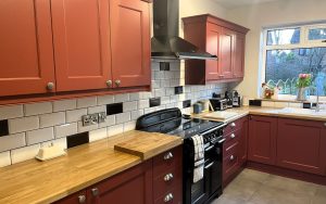 Wakefield Kitchen in Antique Red by Kinder Kitchens