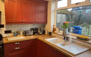 Wakefield Kitchen in Antique Red by Kinder Kitchens